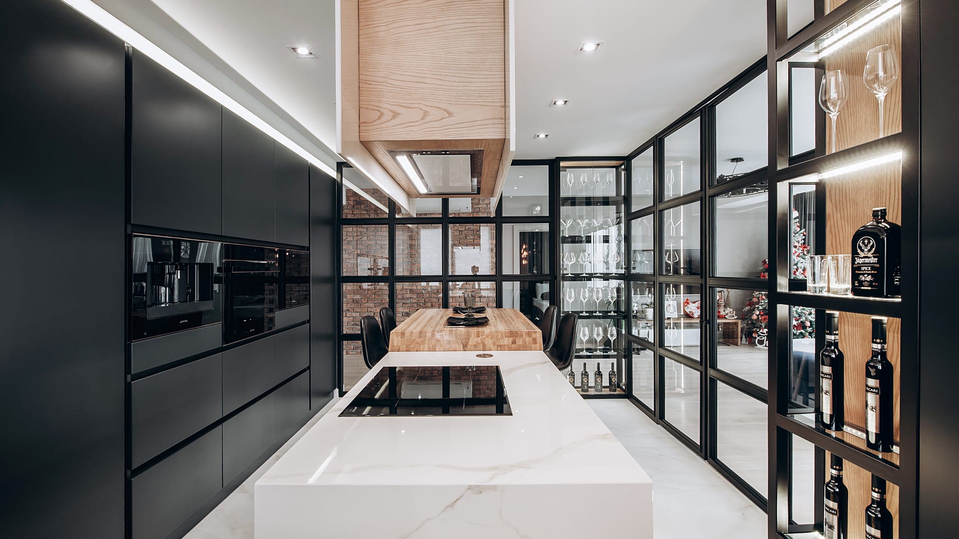 Kitchen interior design with marble island and black cabinetry